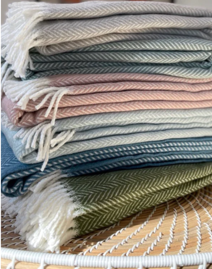 Herringbone plush throw blankets stacked